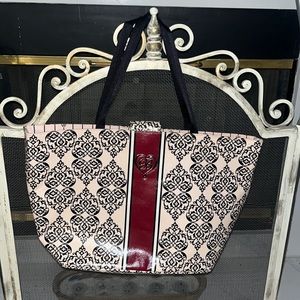 Brighton pink ,black and coated canvas tote embellished with silver tone accent.